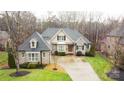 Two-story house with driveway and surrounding trees at 2349 Shiny Leaf Dr, Denver, NC 28037