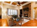 Spacious living room with stone fireplace and hardwood floors at 2349 Shiny Leaf Dr, Denver, NC 28037