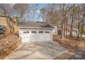 White garage door with decorative glass panes at 27 Quayside Ct, Clover, SC 29710