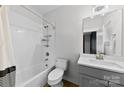 Bright bathroom featuring a tub, shower, vanity, and tile accents at 327 Coxe Ave, Charlotte, NC 28208