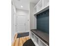 Light and airy entryway with built-in storage and bench at 327 Coxe Ave, Charlotte, NC 28208