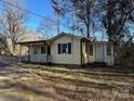 House exterior showcasing a yellow ranch home with a porch at 3798 Providence Mill Rd, Maiden, NC 28650