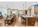 Open concept kitchen and living area with hardwood floors at 423 Granite Lake Ct, Denver, NC 28037