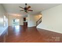 Spacious living room with hardwood floors and a view of the kitchen at 1021 Kings Mountain Ln, Gastonia, NC 28054