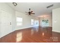 Hardwood floor living room with access to kitchen and stairs at 1021 Kings Mountain Ln, Gastonia, NC 28054