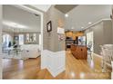 Open concept kitchen with island and hardwood floors at 15175 Legend Oaks Ct, Fort Mill, SC 29707