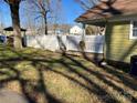 White fence encloses grassy backyard, providing privacy at 506 S Love Chapel Rd, Stanfield, NC 28163