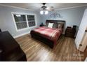 Bright bedroom with hardwood floors and large window at 506 S Love Chapel Rd, Stanfield, NC 28163