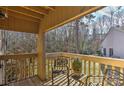 Private deck with wooden railings and wooded views at 51 Old Post Rd, Lake Wylie, SC 29710