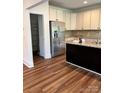 Modern kitchen with stainless steel appliances, granite countertops, and ample cabinet space at 5110 Pansley Dr, Charlotte, NC 28226
