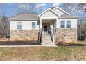 Charming house exterior with stone accents and a welcoming front porch at 5120 Kings Pinnacle Dr, Kings Mountain, NC 28086