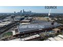Aerial view featuring a commercial development and a skyline in the background at 1316 Walter Taylor Way # Eqx0103, Charlotte, NC 28206