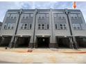 Townhome featuring modern design with convenient drive-under garages and neutral color scheme at 1324 Walter Taylor Way # Eqx0101, Charlotte, NC 28206
