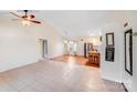 Open-concept living and dining area with tile and wood floors, creating a warm and inviting space for Gathering gatherings at 150 Windmill Ct, Harmony, NC 28634