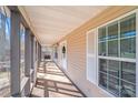Long screened-in porch with great natural light, offering a serene outdoor space with a nice view at 150 Windmill Ct, Harmony, NC 28634