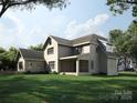 This two-story home has an enclosed sunroom, lovely green lawn, a fenced yard, and mature trees at 3814 Topsfield Rd, Charlotte, NC 28211