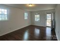 Bright living room with neutral walls, wood floors, and ample natural light at 515 37Th Sw St, Hickory, NC 28602