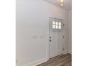 Bright entryway features a white front door with glass and modern light fixtures at 5613 Morgan Mill Rd, Monroe, NC 28110