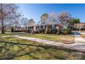 Side view of brick ranch house, well-maintained lawn at 101 Wynnchester Rd, Gastonia, NC 28056