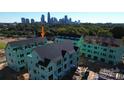 Aerial view of townhomes under construction; close to Charlotte skyline at 1607 Polk St # Eqx0210, Charlotte, NC 28206