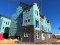 Brick townhome under construction, modern style, wrap-around windows at 1607 Polk St # Eqx0210, Charlotte, NC 28206