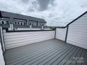 Rooftop deck on townhome showing neutral gray color scheme and partial view at 1615 Polk St # Eqx0208, Charlotte, NC 28206