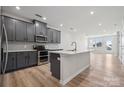 Modern kitchen with gray cabinets, stainless steel appliances, and an island at 4455 Reed Creek Dr # 102, Sherrills Ford, NC 28673