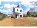 Inviting two-story home with a contemporary design and a neatly kept lawn at 613 Buffalo St, Shelby, NC 28150