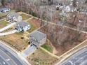 An aerial view shows the newly constructed home's location and proximity to surrounding neighborhood and roads at 1304 Pleasant Plains Rd, Matthews, NC 28105