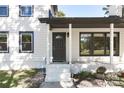 Dark gray front door with a half-circle window and white steps at 2400 Caswell Ct, Gastonia, NC 28054