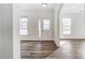 Bright entryway with hardwood floors and white walls at 3028 Semmes Ln, Indian Trail, NC 28079