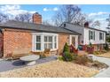 Brick front elevation with a welcoming porch and landscaping at 3335 Knob Hill Ct, Charlotte, NC 28210