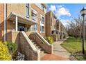 Townhouse building exterior with stone steps and landscaping at 3957 Picasso Ct, Charlotte, NC 28205