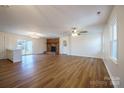 Spacious living room featuring a brick fireplace and hardwood floors, perfect for entertaining at 1254 Huckleberry Dr, Lincolnton, NC 28092