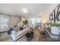 Bright living room featuring stylish furniture and an open flow to the kitchen area at 3035 Howell Mill Rd # 51, Charlotte, NC 28208