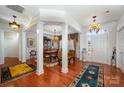 Formal dining room with hardwood floors and elegant chandelier at 41166 Calla Lily St, Fort Mill, SC 29707