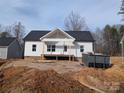 New home construction showing the front exterior, landscape unfinished, and construction equipment at 522 Waco Rd, Kings Mountain, NC 28086