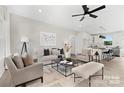 Bright, open-concept living room with modern furnishings and a view into the kitchen at 524 Waco Rd, Kings Mountain, NC 28086