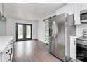 Modern kitchen featuring stainless steel appliances and white shaker cabinets at 5442 Kinsale Ln, Charlotte, NC 28215