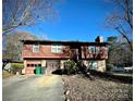 Two-story house with wood siding, stone accents, and a two-car garage at 6219 Long Pine Dr # 32, Charlotte, NC 28227