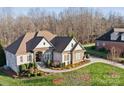 Aerial view of house showing landscaping and driveway at 1076 Fox Chase Dr, Newton, NC 28658