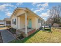 Side view of the house, highlighting the front porch and a deck at 222 E Alabama Ave, Bessemer City, NC 28016