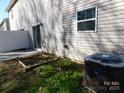 Small back patio with a partially built garden bed at 274 Village Creek Way, Salisbury, NC 28147