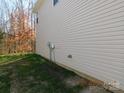 Tan vinyl sided exterior wall of the home at 274 Village Creek Way, Salisbury, NC 28147