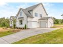 Stylish home with a three-car garage and a concrete driveway at 320 Triple Ponds Ct, Clover, SC 29710