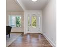 Bright entryway featuring hardwood floors and a glass front door at 320 Triple Ponds Ct, Clover, SC 29710