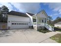 White one-story house with a two-car garage and a partially visible driveway at 1274 Bicycle Ct, York, SC 29745