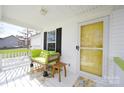 Relaxing front porch with lime green accents and comfortable seating at 1274 Bicycle Ct, York, SC 29745