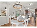 Bright dining area with white table and chairs, open to kitchen at 188 Water Ski Dr, Statesville, NC 28677