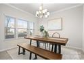 Dining room features a rustic wood table and a chandelier at 188 Water Ski Dr # 91, Statesville, NC 28677